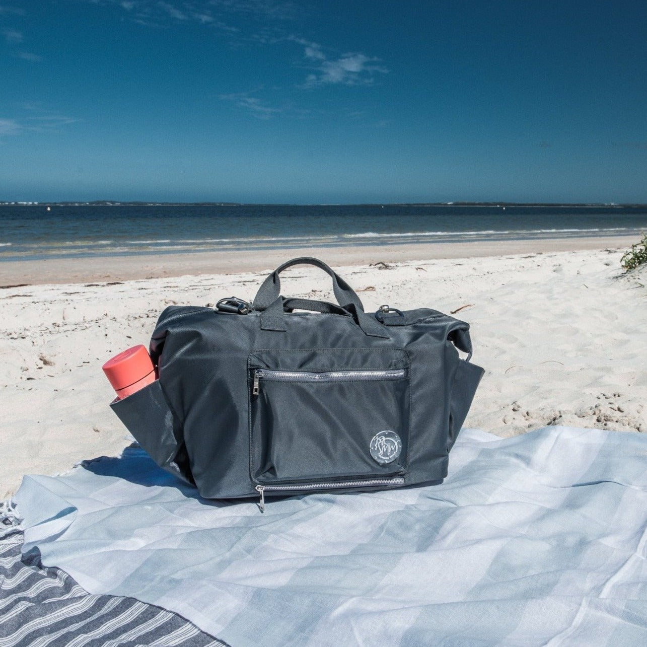 alt="Mummas Wear The DUFFLE All In One Nappy Bag packed as beach bag" 