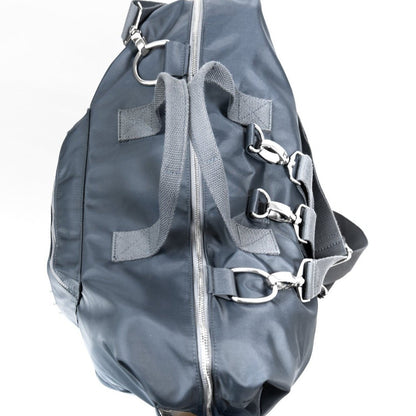 alt="The DUFFLE Nappy Bag carry handles, silver metal hardware, external insulated drink bottle pockets, backpack and crossbody straps"